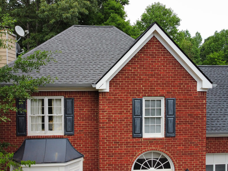 residential property exteriors close up with new asphalt shingles roof installation woodstock ga