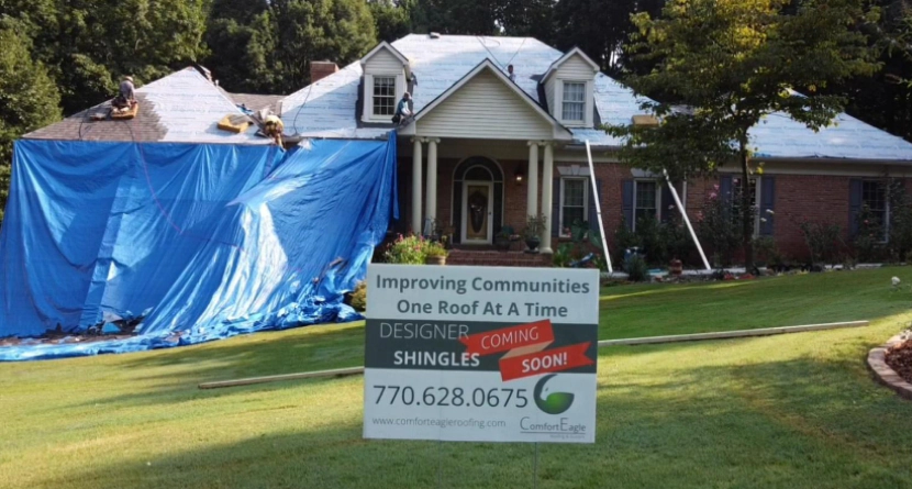 exterior of a house during a roof replacement